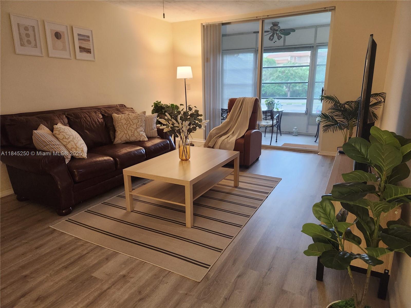 Spacious and elegant 1-bedroom, 1.5-bath condo in the desirable Omega IV community! This beautifully unit stands out for its generous layout: a large and independent living room plus a formal dining area - rare in units this size. The over sized bedroom includes a walk-in closet and two additional closets, offering abundant storage. The 1.5 bathrooms add extra comfort and functionality, perfect for guests and daily living. Enjoy peaceful mornings or relaxing evenings on your private balcony overlooking a lush green area, fully enclosed with windows. An additional storage unit is included in the building-ideal for seasonal items or personal belongings.