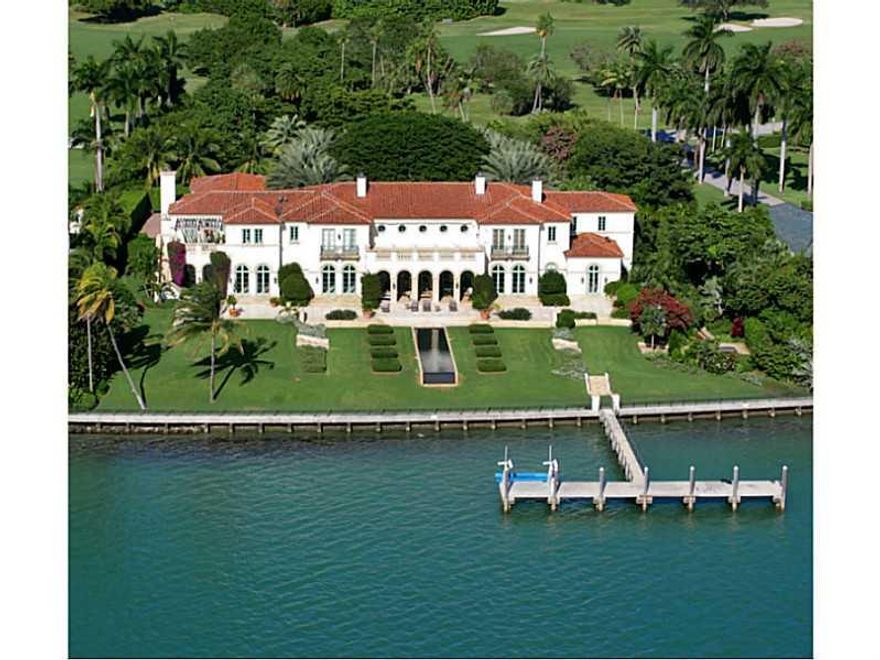 Classic Italian Mediterranean Estate on wide open Biscayne Bay, Spectacular Sunsets and Miami Skyline Views! Located on Private Exclusive Indian Creek Island w/ 24hr Police, 18 Hole Championship Golf Course, moments to BH Shops. Built 2002 this home is a  graceful combination of groin vaulted ceilings, Corinthian columns, large terraces, fireplaces, wine room, summer kitchen, gym, large his/hers closets. 4-Car gar, 255' open bay w/ large concrete dock & lifts. One of a kind estate!