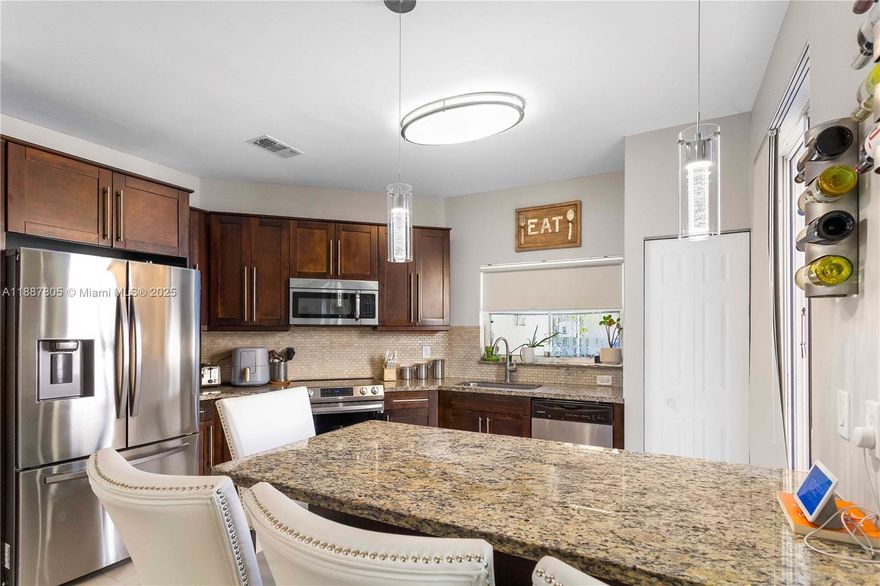 Beautifully updated 3-bedroom, 2.5-bathroom 2 story single-family home with 2 car garage in West Pembroke Pines. The first floor boasts an open layout featuring tile flooring. The modern kitchen is equipped with stainless steel appliances, an island, and ample cabinetry. Upstairs, you'll find new vinyl flooring and three bedrooms, including a spacious primary suite with a walk-in closet and an updated en-suite bathroom. Private fenced backyard with a patio area. Community amenities include a pool and playground. This home is ideally located near schools, shopping, dining, with quick access to major highways. Pets ok.