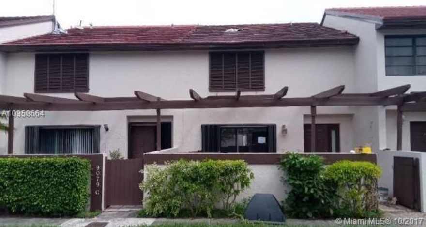 Great opportunity in Calusa Point Community with this spacious 3 bedroom, 2 bath condo in Miami. Large outdoor patio, tile & wood flooring, updated bathrooms. Needs work, but make it your own.