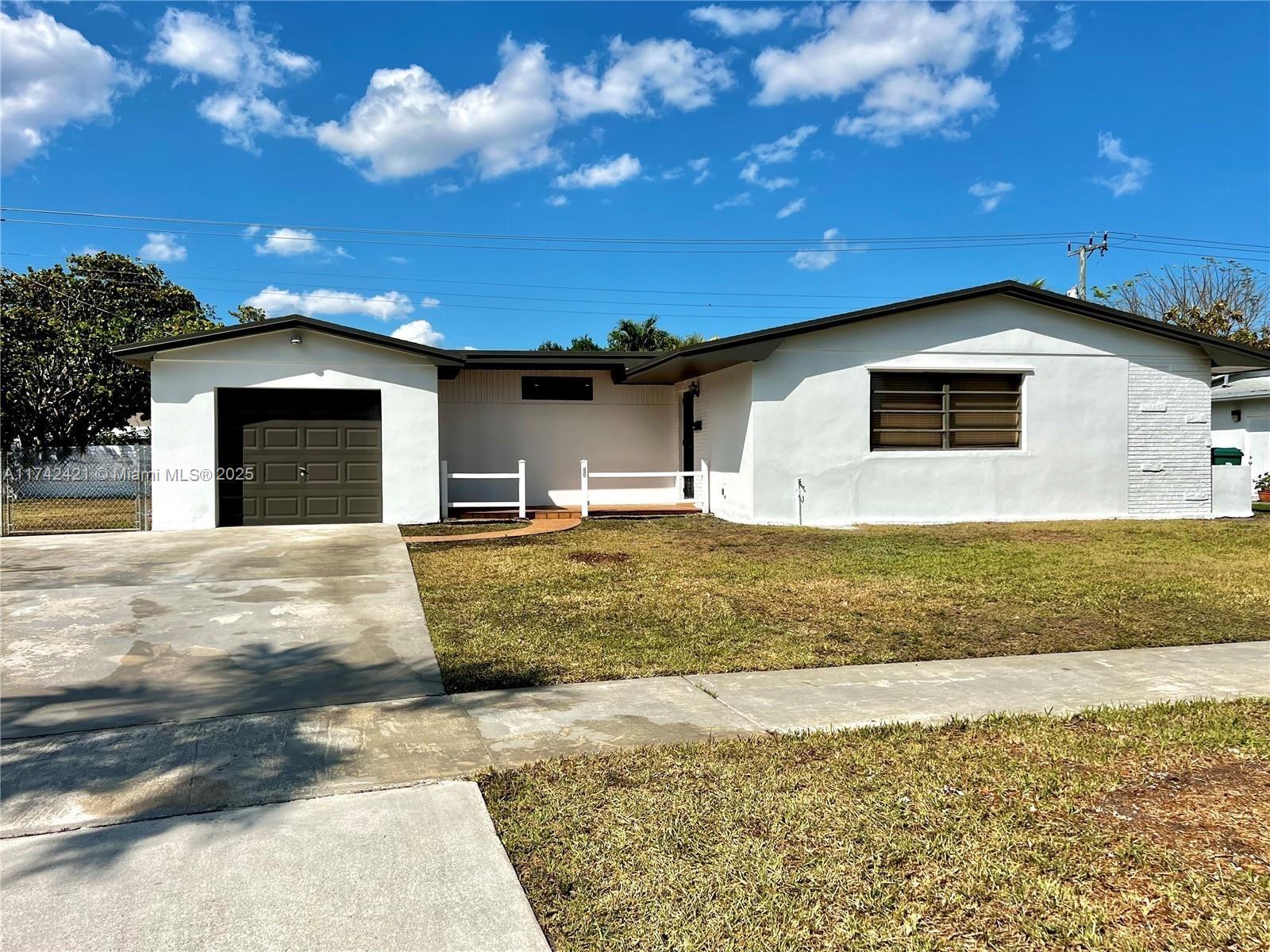 Charming 3-bedroom, 2-bathroom home in the heart of Cutler Bay! This beautifully updated residence features laminate wood flooring throughout, creating a warm and modern ambiance. The open-concept living, dining, and kitchen area is perfect for entertaining, with stainless steel appliances and sleek finishes. Each bedroom is generously sized, complete with ceiling fans and ample closet space. Both bathrooms have been tastefully upgraded with contemporary fixtures for a luxurious feel. Step outside to a large screened-in patio and a spacious front and backyard—ideal for outdoor gatherings or playtime. LED lighting throughout adds efficiency and style. Don’t miss this fantastic opportunity—schedule a showing today!