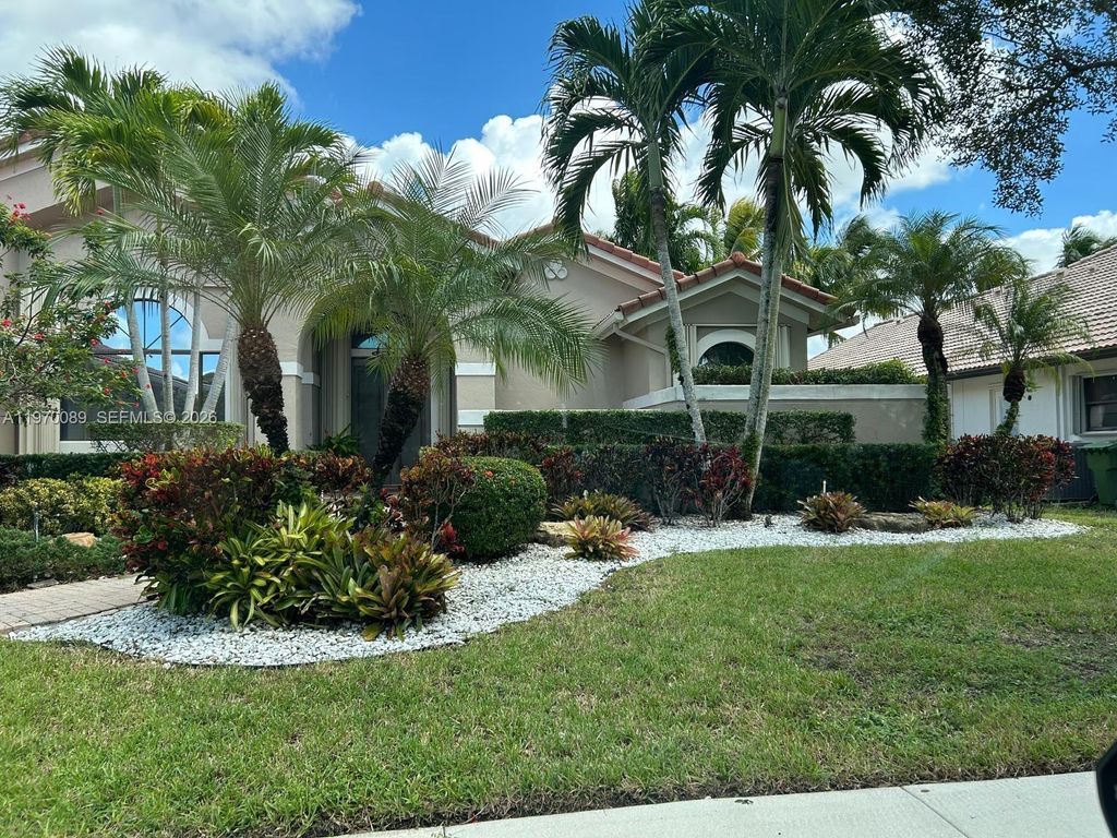 Photo of 1040 Sandalwood Ln, Weston, FL 33326 (MLS # A11970089)