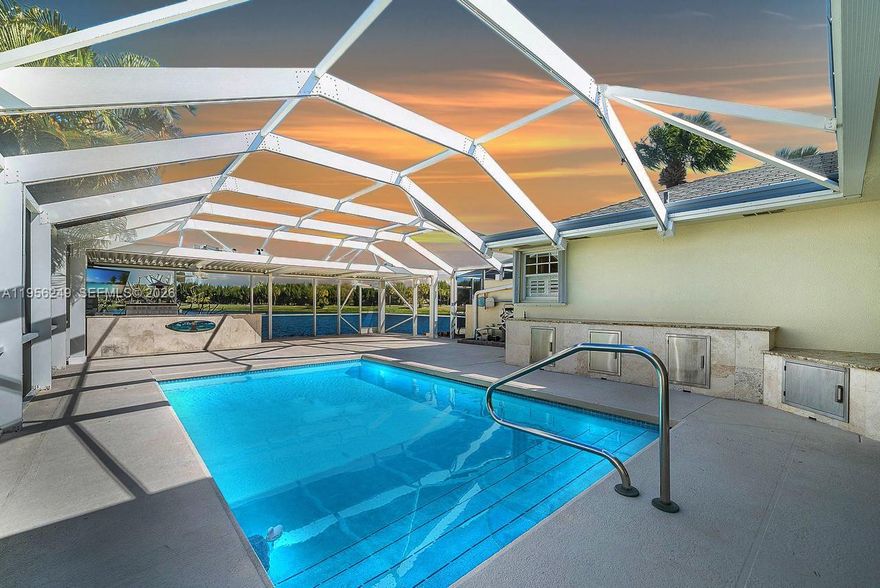 Welcome to your South Florida retreat in the desirable Greenbrier community of Jupiter! This beautiful 2-bedroom, 2-bath townhouse blends comfort, style, and the best of Florida living. Illuminated walkways lead you to a spacious extended patio and pool deck, complete with a custom outdoor kitchen featuring granite countertops, stainless appliances and grill, ample storage, a weatherproof flatscreen TV, and an automated Arcadia louvered roofing system for adjustable sun or shade. Enjoy your heated pool year-round while taking in the serene lake and golf course views. The community offers fantastic amenities including a pool, tennis and pickleball courts. Golfing available just moments from your door. Located close to top-rated A+ schools, incredible restaurants, shopping, nature trails, and the Atlantic Ocean and beaches, this home combines luxury with convenience. Don’t miss the chance to live where others vacation—schedule your private showing today!