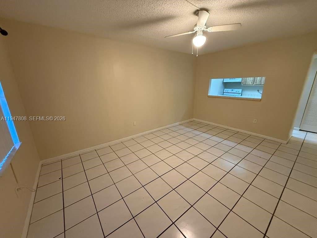 Photo of 6031 Shakerwood Cir #107, Tamarac, FL 33319 (MLS # A11947808)