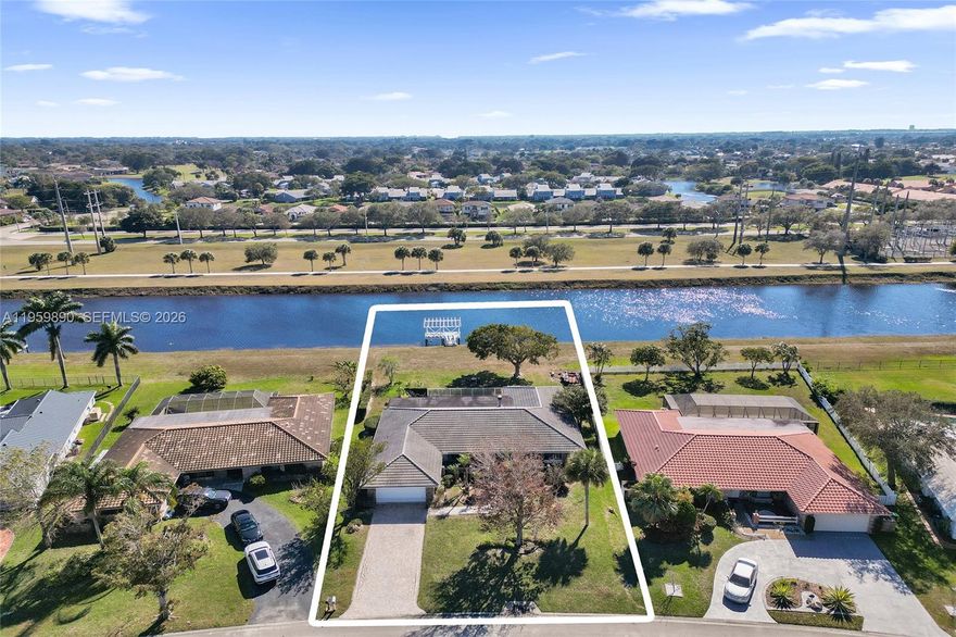 WOW! INCREDIBLE OPPORTUNITY! RARELY AVAILABLE C-14 LOT LOCATION WITH A BUILT-IN DOCK! BRING YOUR BOAT! POPULAR KINGSLEY MODEL WITH 2,788 SQ. FT. LIVING AREA WITH GOURMET UPDATED KITCHEN, UPDATED BATH, ACCORDION SHUTTERS AND IMPACT GARAGE DOOR! BRAND NEW FLAT ROOF FEBRUARY 2026! SPACIOUS ROOM WITH PLENTY OF CLOSET SPACE! AWESOME POOL/PATIO AREA WITH WATERFALL POOL AND SUMMER KITCHEN! NEAT, CLEAN, AND READY TO GO!