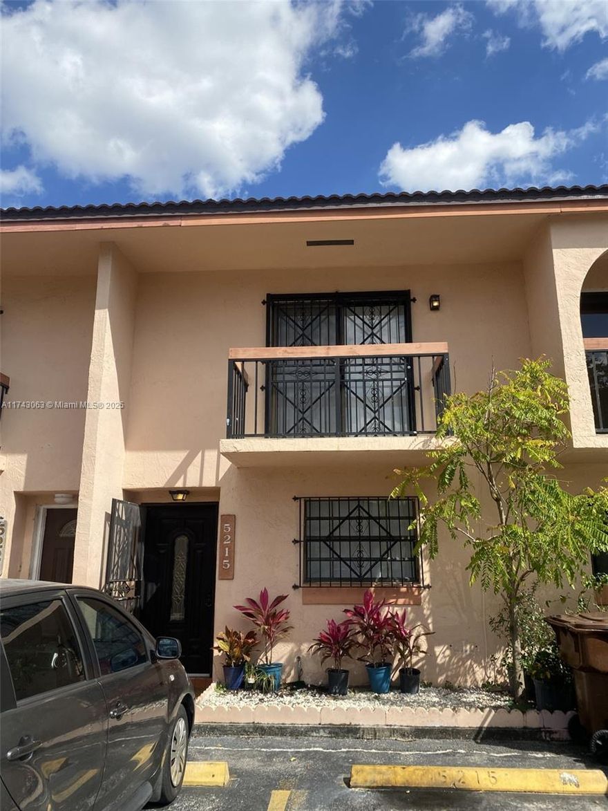 Perfectly located townhouse with 2 assigned parking spaces conveniently right outside your door. Screened porch with uncovered area for sunbathing for yourself, pets, or plants. Gorgeous sunsets from master bedroom balcony. Gated community near shopping, expressway, and Miami International Airport. Very desirable rental area so easy to have as rental property. Feels and looks much larger in person- a must see! HOA is only $286! No assessments!