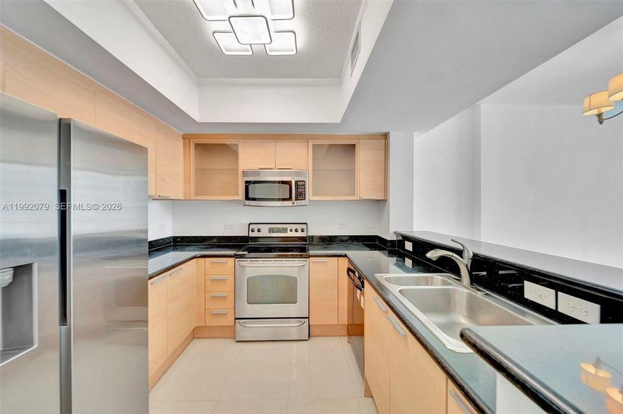 Spacious 1 bed, 1 bath condo with pool deck views in the peaceful side of downtown living. Porcelain tile, granite counters, stainless steel appliances, upgraded lighting, and central air conditioning. This unit includes 2 assigned parking inside the garage. Conveniently located within walking distance to restaurants, markets, and shops, and perfectly situated between Aventura and Fort Lauderdale. Recently renovated condo amenities, on-site management, 24/7 concierge, and secure fob access to garage, entry, and elevators.