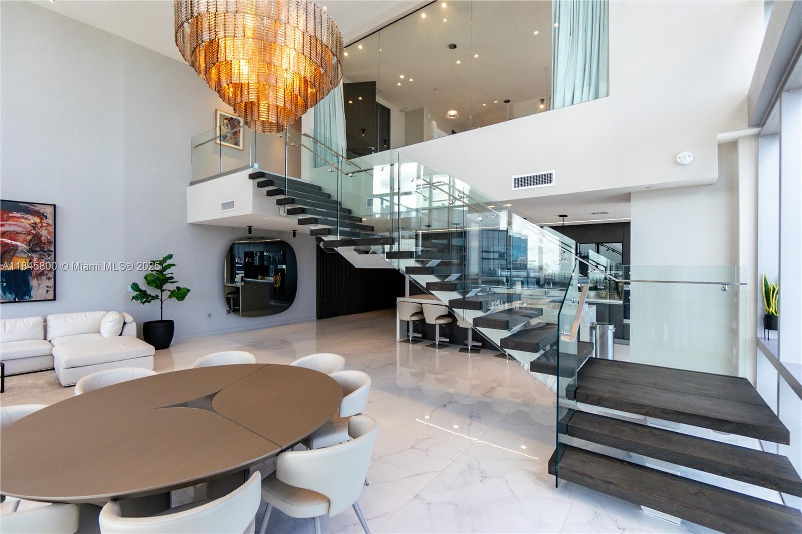 Welcome to Penthouse 4611 at The Miami World Center, an unparalleled duplex penthouse in Downtown Miami's premier amenity-focused building. Spanning 4,000 sq ft, this extraordinary residence boasts 4 bedrooms and 5.5 bathrooms. Revel in the picturesque sunrise and sunset views that encompass all of Brickell and Downtown Miami. Penthouse 4611 comes fully furnished with exquisite pieces from Artefacto and Modani, and features frame TVs in every bedroom. Each room has blackout shades and Control4 systems. Residents enjoy world-class amenities, including multiple pools, a fitness center, a spa, a children's play area, and a rooftop observatory, plus a basketball court, boxing studio, recording studio, and golf simulator.Experience luxury living with breathtaking vistas and high-end furnishing