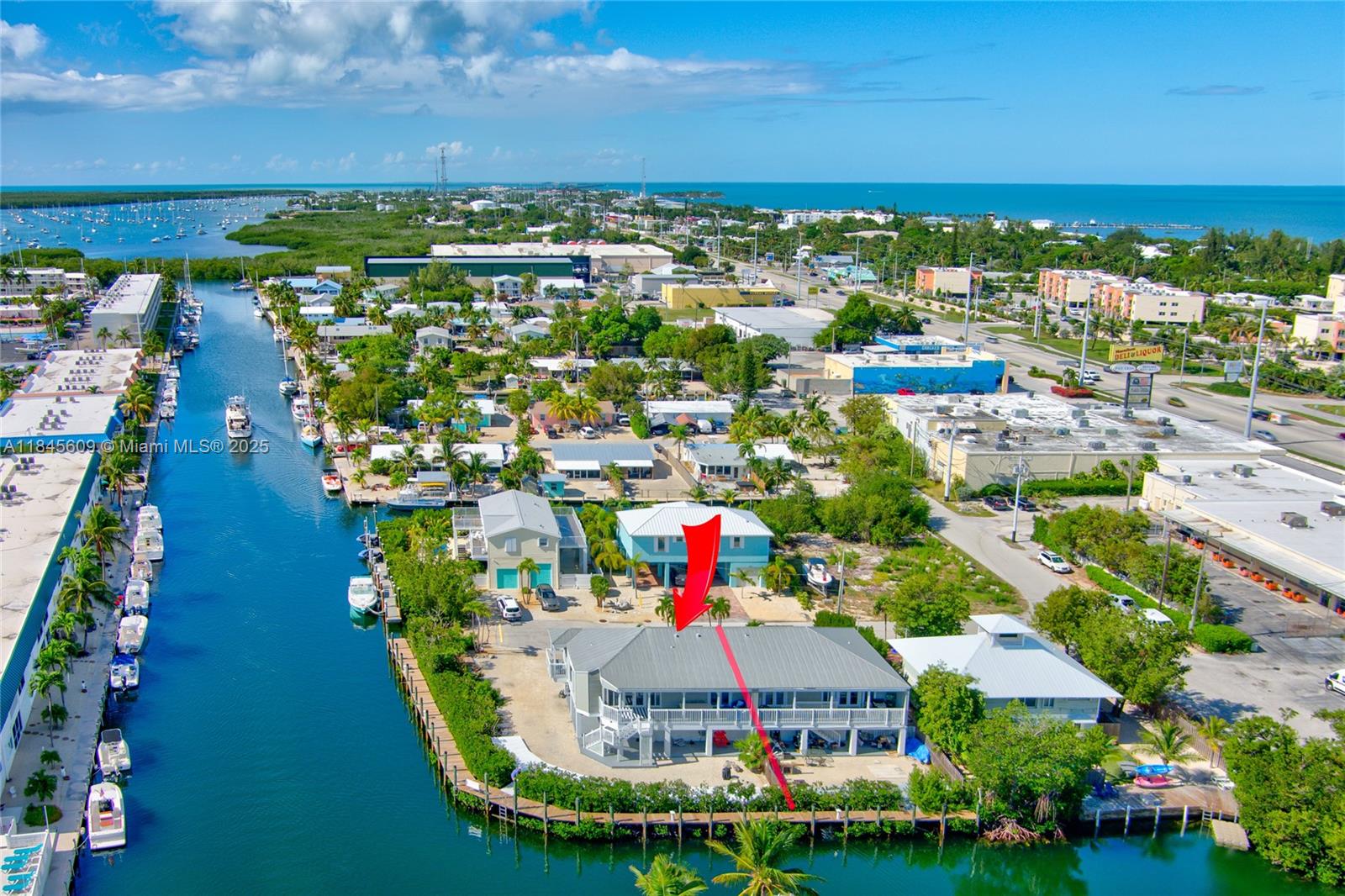 STUNNING 3 BEDROOM 3 BATH TURN KEY LUXURY HOME THAT IS CURRENTLY A FULLY FURNISHED TURN-KEY, vacation rental in the Florida Keys. This beauty offers luxury living & a highly profitable business. Generating six figures annually! Semi-private boat ramp, 174 FT DOCK, DEEP & WIDE CANAL accommodating multiple boats with direct access to the ocean, & easy commute to bay side. Gourmet chef's kitchen, plush furnishings, garage, huge storage with electric & stunning waterfront views.The two main suites have king beds, 3RD includes a queen-over-queen bed & a full trundle. ENORMOUS dock has a fish cleaning station, electric, and water. Nearby attractions include SOMBRERO BEACH, airport, dolphin swims, scuba, playgrounds, & restaurants. Seize this opportunity to live and invest where others vacation!
