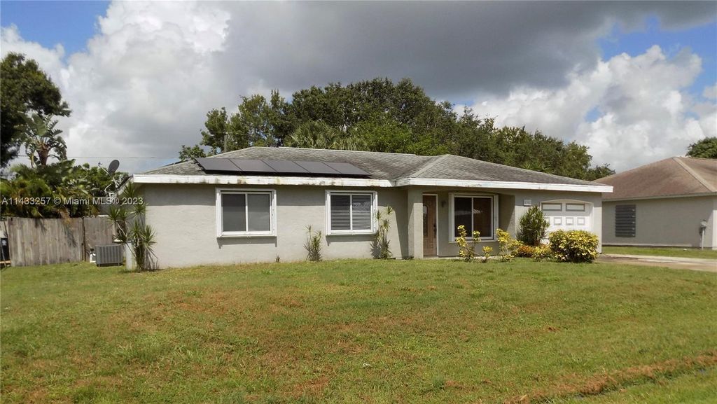 Photo of 1902 SE Aneci St, Port Saint Lucie, FL 34983 (MLS # A11433257)