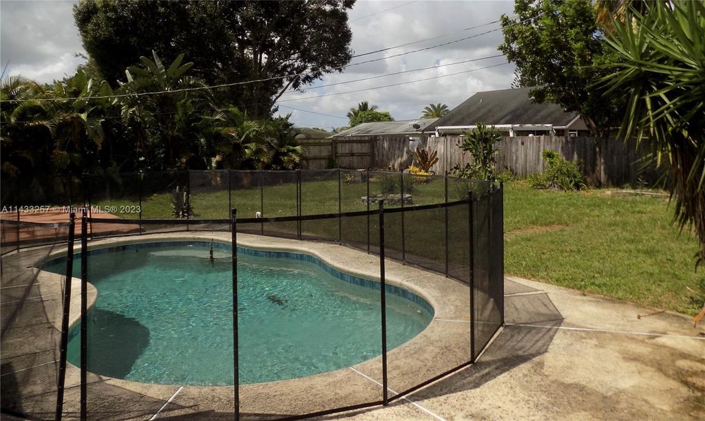 Photo of 1902 SE Aneci St, Port Saint Lucie, FL 34983 (MLS # A11433257)