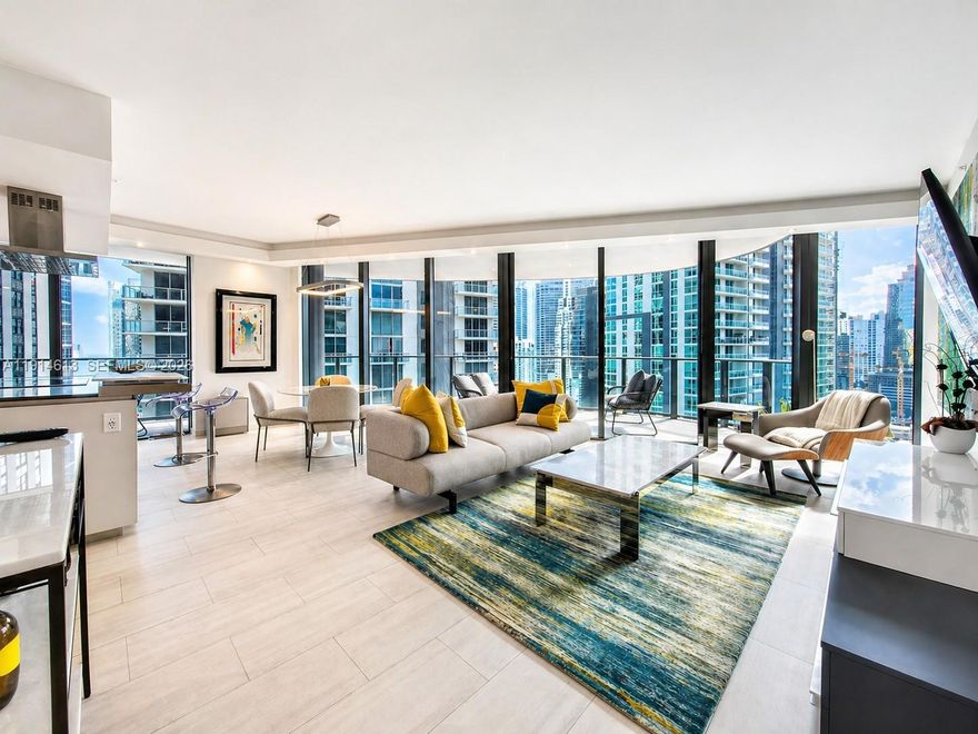 Beautiful two-bedroom residence: Interior 1,400 SF, Terrace 500 SF, located in the heart of Brickell in the luxurious Flatiron, Brickell's finest tower by renowned developer Ugo Colombo. Enjoy 180° breathtaking views of the city and bay, framed by floor-to-ceiling glass doors and elliptical balconies. Electric window are installed throughout the unit. Italian kitchen equipped with MIELE appliances. The residence features Barausse Italian custom doors 7 feet tall. Flooring includes Marble and Italian porcelain tile by Casalgrande Padana. Assigned parking plus free valet. 24/7 security. Amenities, including a movie theater, wine room and social rooms, rooftop gym, pool, spa, kids' room, and kids' pool. Walking distance to shops and restaurants and a short drive to Miami International Airport and Miami Beach.
