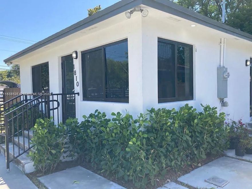 STUNNING THREE BEDROOMS TWO BATHROOMS, TILE FLOORS, NEWLY REMOLDED BATHROOMS, NEW KITCHEN WITH GRANITE COUNTER TOPS AND STAINLESS STEEL APPLIANCES, WASHER AND DRYER, PRIVATE FENCING AND CUSTOM DRIVEWAY. NEW ROOF, NEW IMPACT WINDOWS, IMPACT DOORS