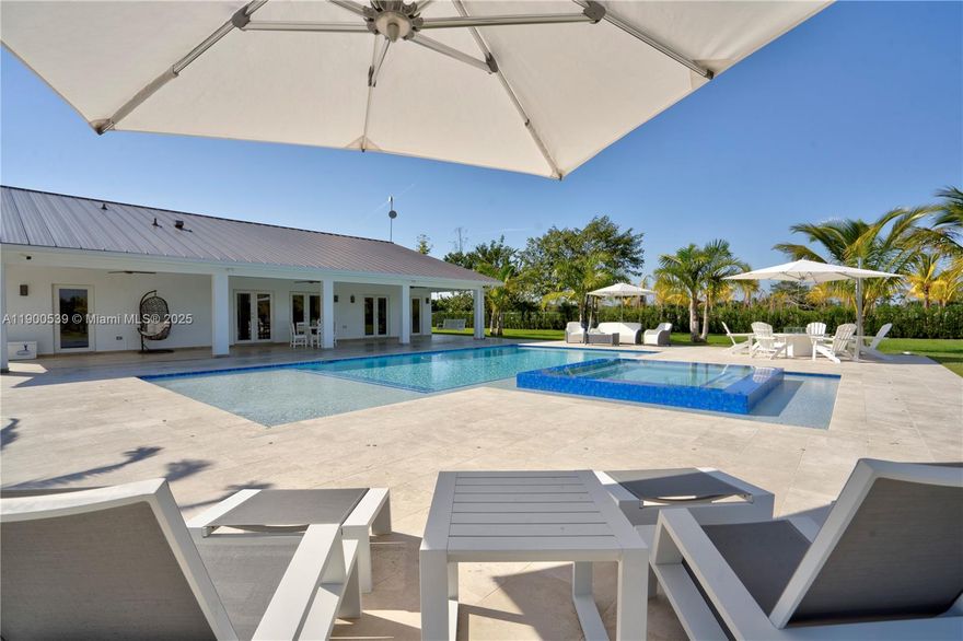 Welcome to Paradise!! This 4.79 lot (208,652 sq/ft) consists of a main house, guest house, 40x30 salt water pool with whirlpool, surrounded by fruit trees, palm trees and an unbelievable outdoor entertainment area for all of your friends and family. The entire property was renovated inside and out with a blend of luxury and countryside living. Property features 5 Bedrooms and 4 bathrooms that includes a separate 1 bedroom and 1 bathroom guest house. Entire property has hurricane impact windows. A must see dream property!!