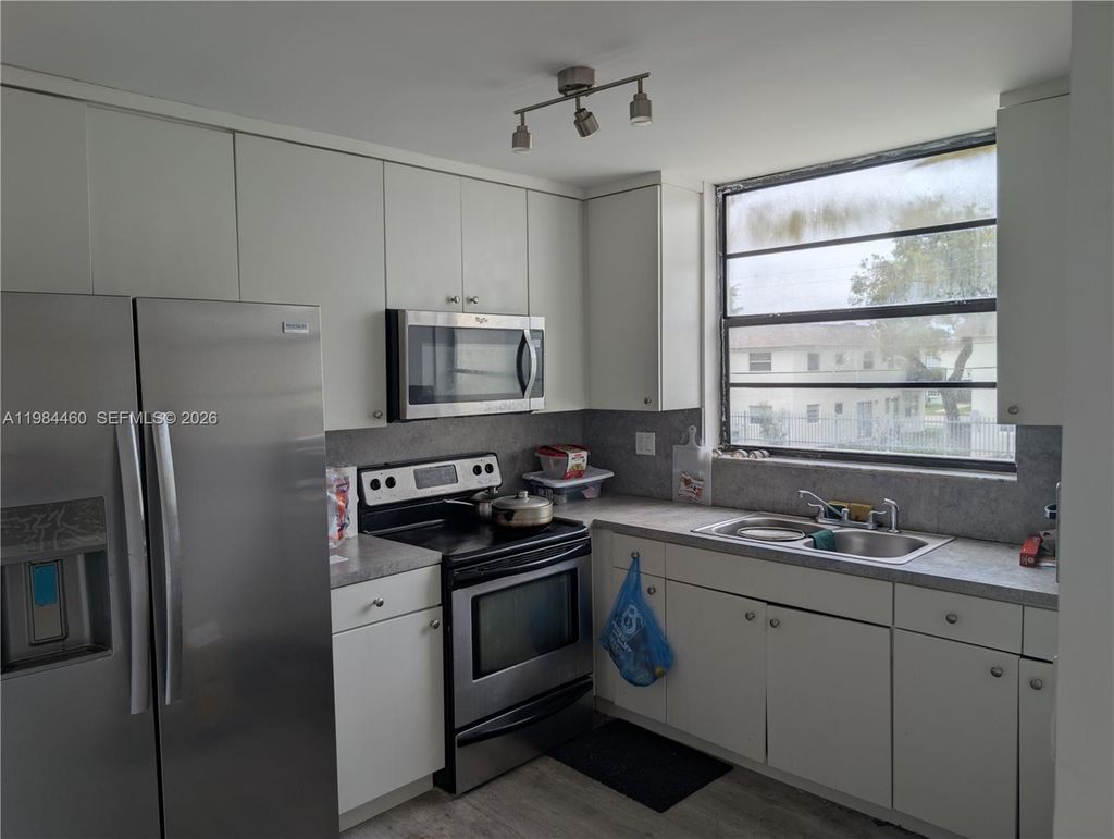 Photo of 1788 NW 55th Ave #203, Lauderhill, FL 33313 (MLS # A11984460)