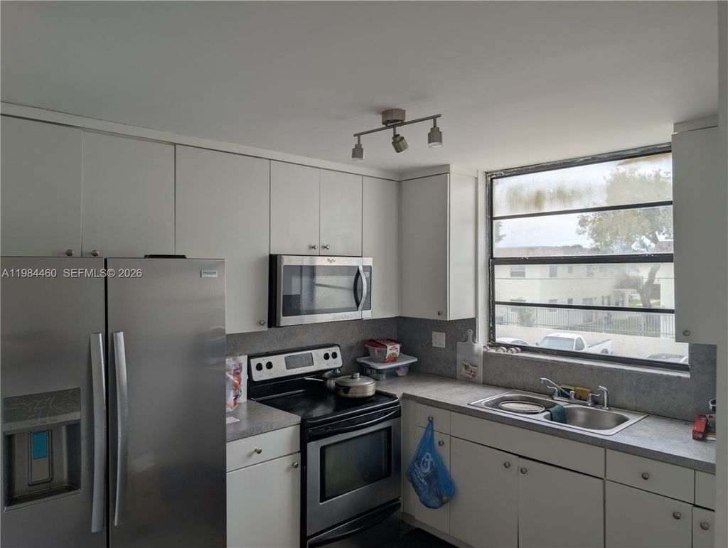 Photo of 1788 NW 55th Ave #203, Lauderhill, FL 33313 (MLS # A11984460)