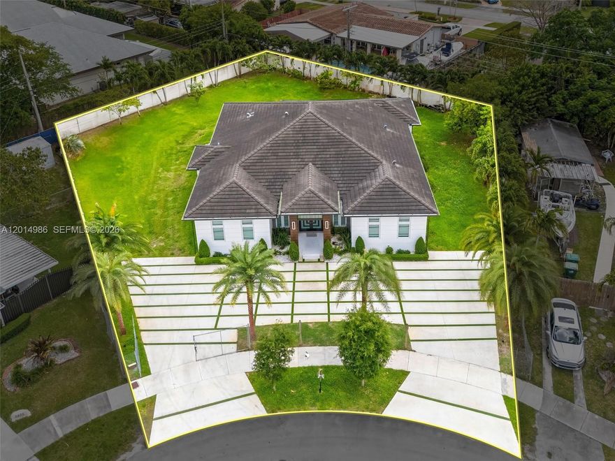 This exceptional property is situated in a coveted neighborhood. On a 24,075 sqft lot, it features 4 bedrooms 4 bathrooms and an extra room that serves as flexible space. New construction, it boasts 2022 updates to the roof, electric, and plumbing. The interior showcases elegant Spanish porcelain floors and 10.6 ft ceilings, with both indoor and outdoor kitchens adorned with quartzite counters, seamlessly connecting the spaces, and perfect for entertaining. Impact-resistant windows and doors offer security, while LED lighting throughout enhances the home’s bright and vibrant feel. A gas meter powers appliances reducing electricity costs. Additional highlights include two 2020-installed AC units, a security system, and a turbine sprinkler system, ensuring convenience and peace of mind.