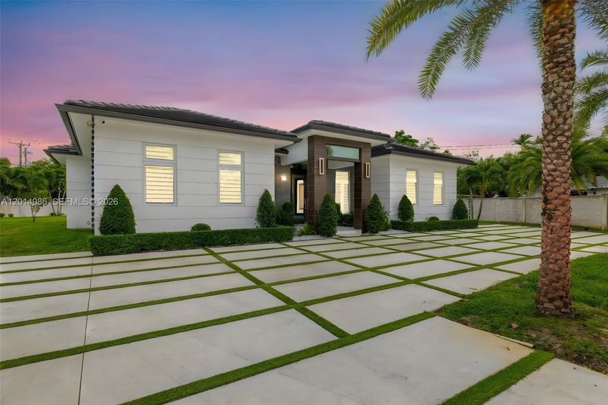 This exceptional property is situated in a coveted neighborhood. On a 24,075 sqft lot, it features 4 bedrooms 4 bathrooms and an extra room that serves as flexible space. New construction, it boasts 2022 updates to the roof, electric, and plumbing. The interior showcases elegant Spanish porcelain floors and 10.6 ft ceilings, with both indoor and outdoor kitchens adorned with quartzite counters, seamlessly connecting the spaces, and perfect for entertaining. Impact-resistant windows and doors offer security, while LED lighting throughout enhances the home’s bright and vibrant feel. A gas meter powers appliances reducing electricity costs. Additional highlights include two 2020-installed AC units, a security system, and a turbine sprinkler system, ensuring convenience and peace of mind.