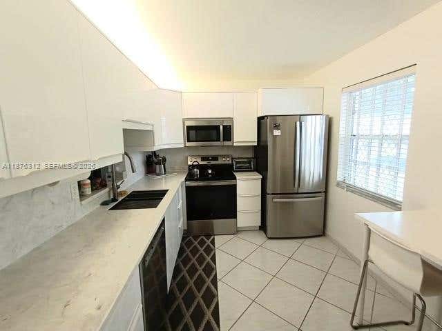 Photo of 1025 SE 4th Ave #101, Dania Beach, FL 33004 (MLS # A11876312)
