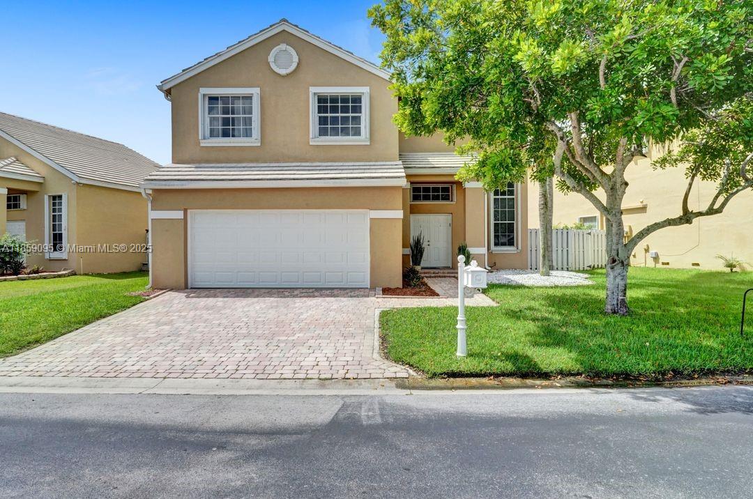 Tucked in the gated community of Bermuda Springs this spacious 2-story 4 bed 2.5 baths updated home with designer lighting, newly remodeled white modern kitchen, stainless steel appliances and quartz counters, high volume ceilings in the living room. Contemporary wood look floors in all living areas and on stairs. Owners bedroom suite upstairs with renovated bath including dual sinks & new white vanity, roman tub, and shower. Walk to A-rated schools, zoned for Cypress Bay. Close to dining, shopping, and Markham Park nearby. 5 minutes to I-75