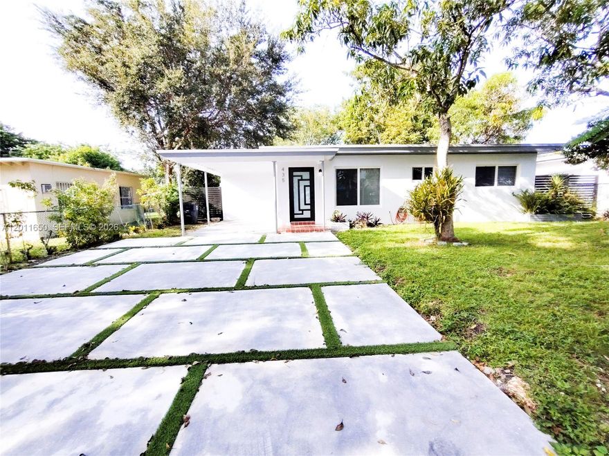 Welcome home to this beautifully updated mid-century bungalow where old Florida character meets fresh, modern style. From the moment you pull into the concrete-slab-and-turf driveway, you'll feel the difference — this one was done right. Step inside and be greeted by polished terrazzo floors. The open layout flows effortlessly from the living and dining area into a fully updated kitchen featuring crisp white cabinetry, quartz countertops, a farmhouse sink with matte black fixtures, and a subway tile backsplash. The bedrooms are spacious and serene, The renovated bathroom is straight out of a design magazine — floor-to-ceiling white subway tile, a glass-enclosed walk-in shower with a matte black rain head, round mirror, and terrazzo floors that tie the whole home together in the most satisfying way.
Out back, the covered patio opens to a fully fenced yard .Here's the kicker: the floor plan is a natural for conversion to a 3-bedroom, 2-bathroom layout , the bones are already there for the savvy buyer ready to add instant equity or maximize rental income.
Come see it before someone else does