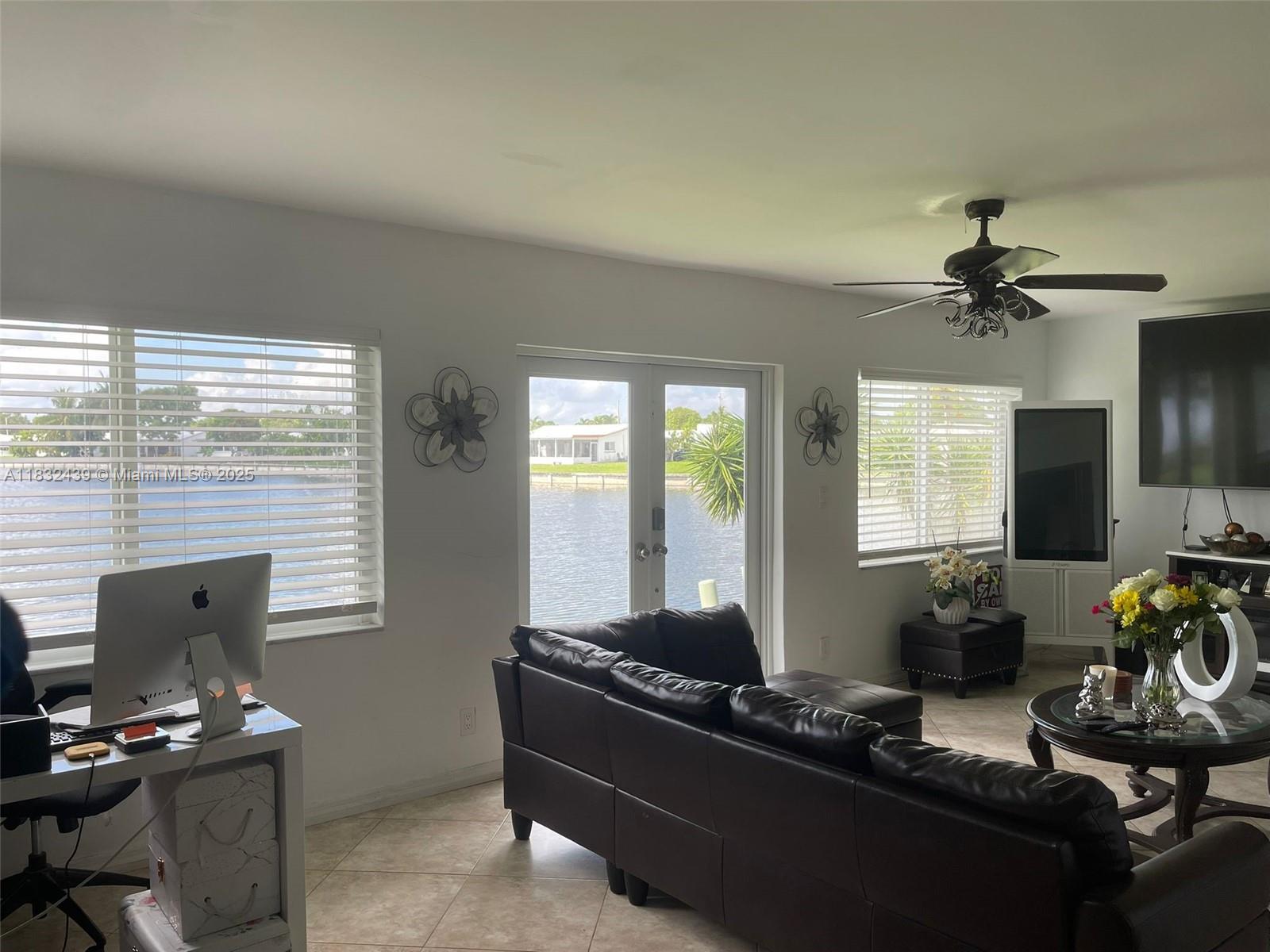 Beautifully updated 2-bed, 2-bath home with 1,445 SF in a sought-after 55+ Tamarac community. Features include a modern kitchen with granite countertops, stainless steel appliances, updated bathrooms, and newer windows and doors. Enjoy a formal living room, dining area, and bright Florida room that opens to a spacious private terrace with tranquil water views. Walkable neighborhood near shopping, dining, library, healthcare, and major highways—just a short drive to the beach. Monthly HOA is only $95/month! Move-in ready and perfectly located!
