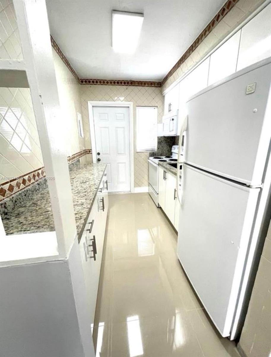 CORAL GARDENS CONDO BLDG - Residential Lease
