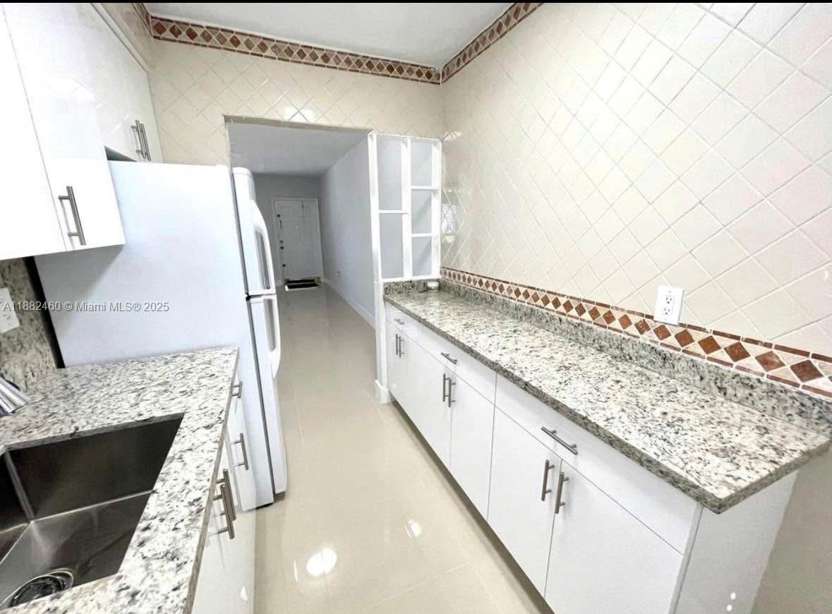 CORAL GARDENS CONDO BLDG - Residential Lease