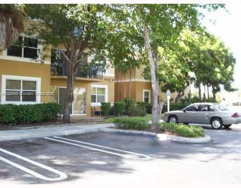 Photo of 8821 Wiles Rd #102, Coral Springs, FL 33067 (MLS # A11885949)