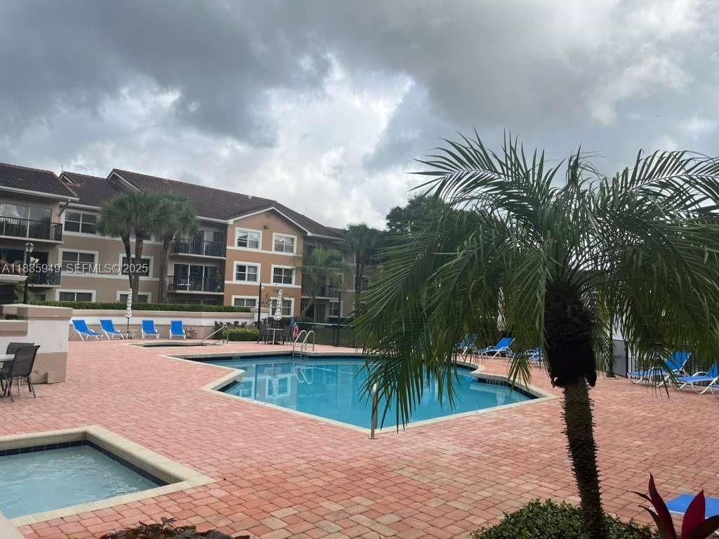 Photo of 8821 Wiles Rd #102, Coral Springs, FL 33067 (MLS # A11885949)