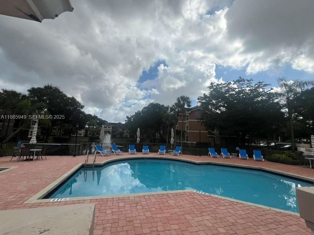 Photo of 8821 Wiles Rd #102, Coral Springs, FL 33067 (MLS # A11885949)