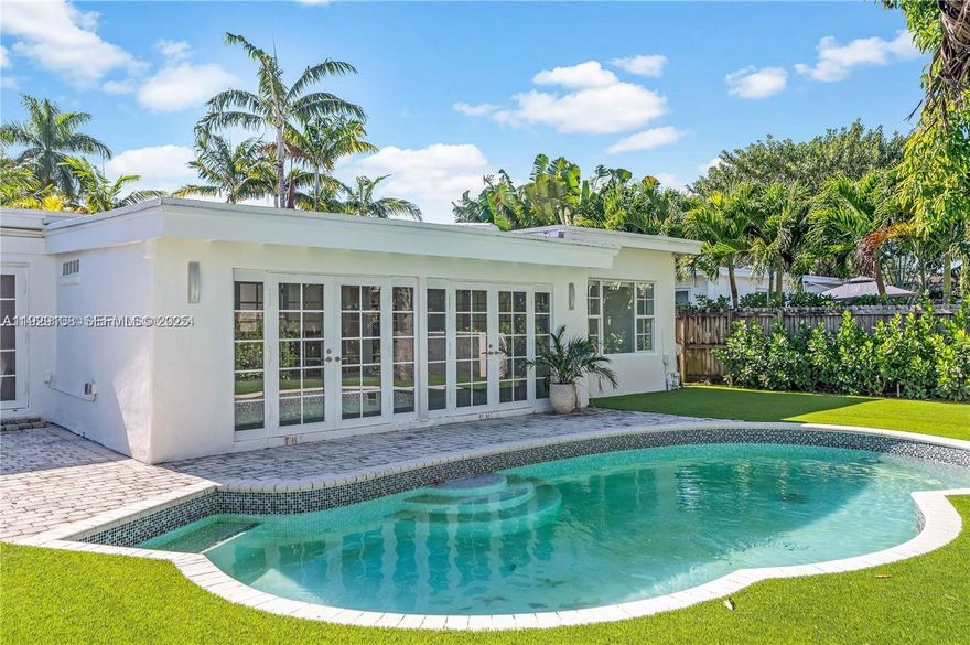 A fully renovated and furnished 4/3 Miami Beach Home – where vintage charm and modern living blend flawlessly. A Zen-like ambiance guides you to a resort-style pool and lush landscaping, while new 48” porcelain floors brighten the interior space. An elegant decorative fireplace sets the scene for entertaining.  The split floor plan guarantees privacy. The renovated primary bathroom offers a spa-like experience. Oversize laundry room. This home offers golf course views and a park down the street. The community offers tennis, golf and a clubhouse to have social gatherings. This gated community is ideally located minutes from the ocean, town center, The Design District, Midtown and South Beach. Brand new furniture. Unfurnished is available.