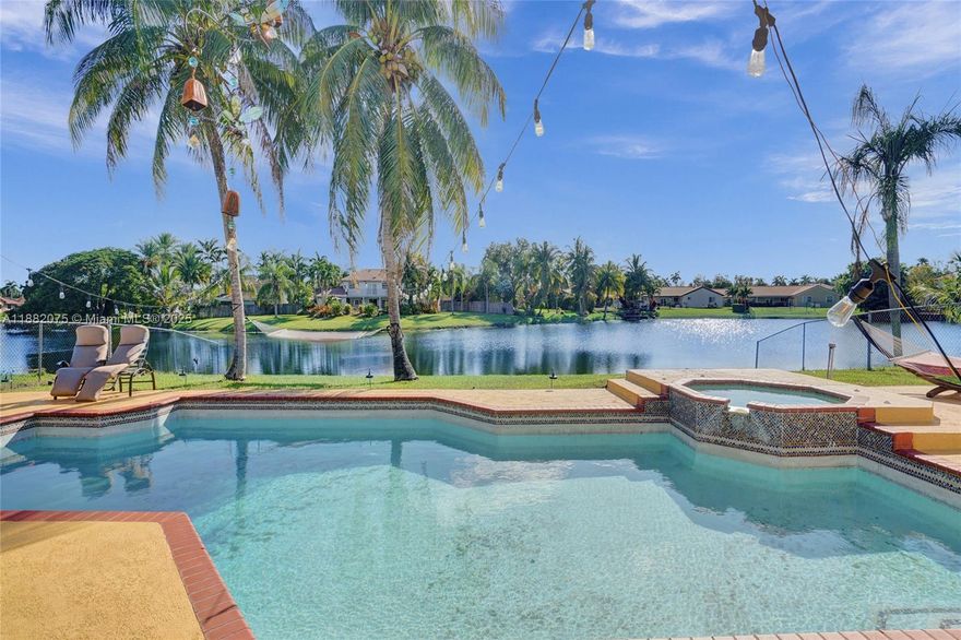 Lakefront living in this beautifully maintained 4-bedroom, 3.5-bath single-story home with a private pool & spa in
the desirable Hawkes Bluff community. It features a bright, open floor plan with Tile/Vinyl floor and freshly painted
interiors with new recessed lighting. The oversized primary suite offers two full bathrooms and large walk-in
closets, providing comfort & privacy. Enjoy peaceful 360° lake views from your backyard oasis, complete with a
sparkling Pool & Spa - ideal for relaxing or entertaining. Additional features include accordion shutters, dual-zone
A/C units, a 2-car garage & an extra refrigerator in the garage! Located close to top-rated schools, shopping,
dining, and I-75 highway, this home offers both tranquility and accessibility.