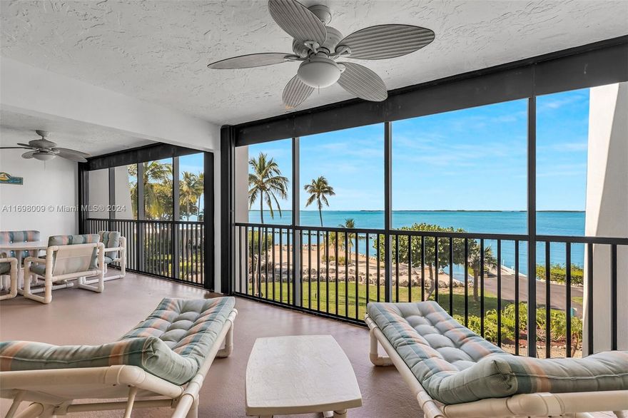 Enjoy breathtaking bay views and sunsets from this spacious 3-bedroom, 3-bathroom Bayfront condo at Rock Harbor Club in Key Largo. The open floor plan includes a large kitchen with wood cabinetry, ideal for entertaining. Each bedroom features a walk-in closet, and the private screened balcony offers expansive bay views. This exclusive, gated community offers easy boating access with dry rack storage, dockage, and a protected basin. Amenities include heated/chilled pools, pickleball, tennis, basketball, kayaking, a Bayfront clubhouse with a gym, and a sandy beach. Live in the Florida Keys dream at Rock Harbor Club!