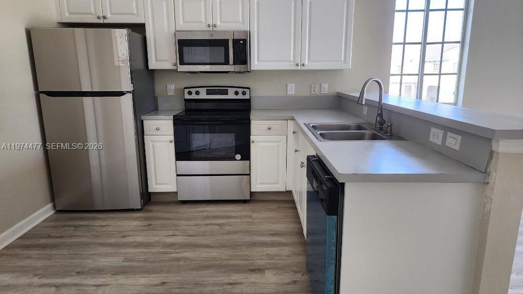 Photo of 1952 Marsh Harbor Dr #1952, Riviera Beach, FL 33404 (MLS # A11974477)