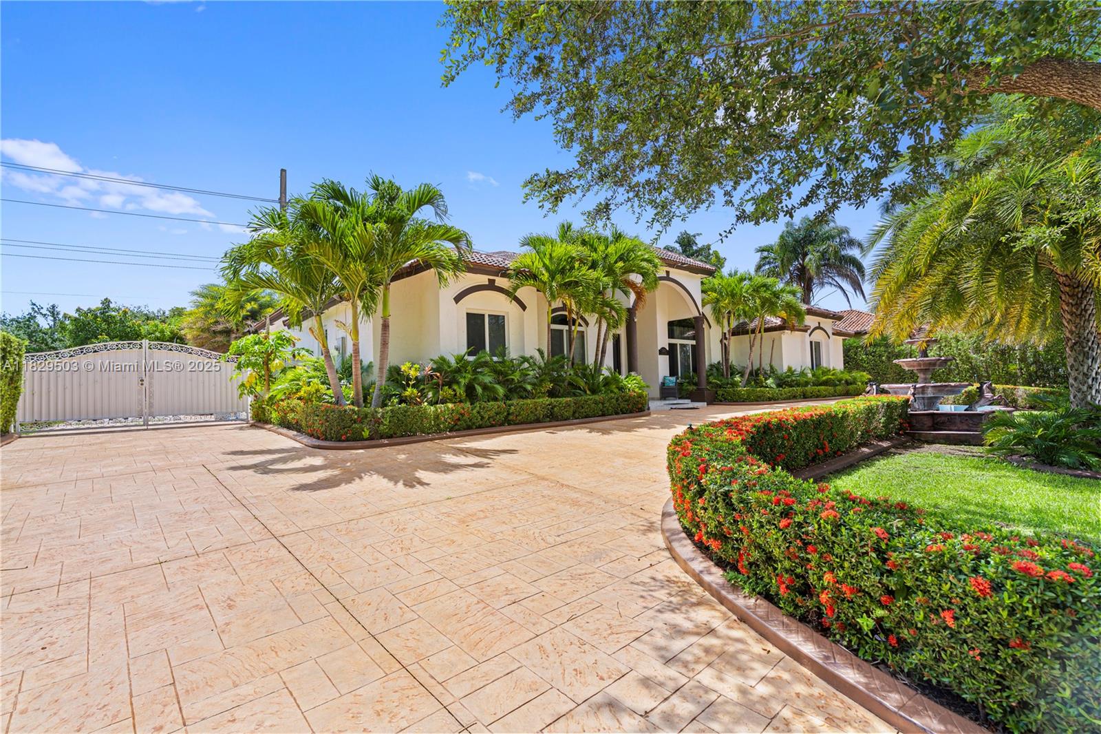Step into timeless elegance at this meticulously remodeled residence, where high design meets relaxed Florida living. Situated on a generous 15,000 sq. lot in one of Palmetto Bay's most exclusive enclaves, this home offers curated interiors, soaring vaulted ceilings, and bespoke finishes throughout. The chef's kitchen is a masterpiece crafted with sleek quartz countertops, custom cabinetry, and premium appliances. Spacious living areas flow effortlessly into the backyard oasis, where a sparkling pool, custom-built pergola, and fully outfitted outdoor kitchen set the stage for unforgettable entertaining. Whether you're hosting under the stars or enjoying quiet moments in your private retreat, this home offers a rare blend of sophistication, comfort, and lifestyle.