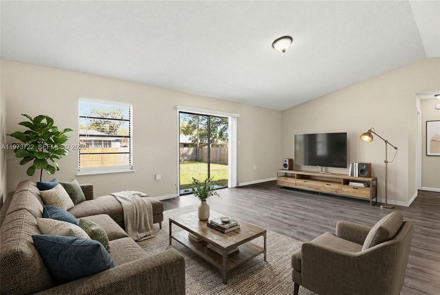 Located in the established community of Deltona Lakes, this 3-bedroom, 2-bath home offers a practical layout with plenty of natural light throughout. Wood floors run through the main living areas, adding warmth and durability. The home features comfortable living and dining spaces along with well-sized bedrooms. The large backyard provides plenty of room for entertaining, pets, or future additions. Conveniently located near shopping, dining, parks, and major roadways. A great opportunity for homeowners or investors alike.