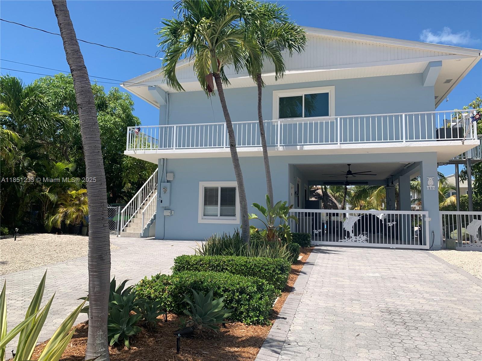 Now available for Annual Rental. Beautiful 3/3 bayside waterfront home in Kahiki Harbor. 65' canal front with davits. Fully furnished & Turnkey Ready! 2/2 upstairs with cathedral ceilings, Great room- kitchen, living room and dining area -opening to a wrap-around porch. 1/1 private suite downstairs. Lots of extras- Elevator- Cargo lift, Electric car charging port, Tackle Room, Ice Machine & extra freezer. Completely fenced with an open patio downstairs and Outdoor kitchen and Chickee hut. First, last and security deposit required, as well as credit and background check. Don't miss the chance to call this tropical waterfront retreat your home!