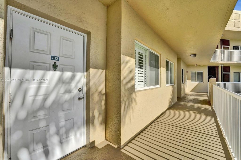 Photo of 7739 Southampton Ter #312, Tamarac, FL 33321 (MLS # A11625292)