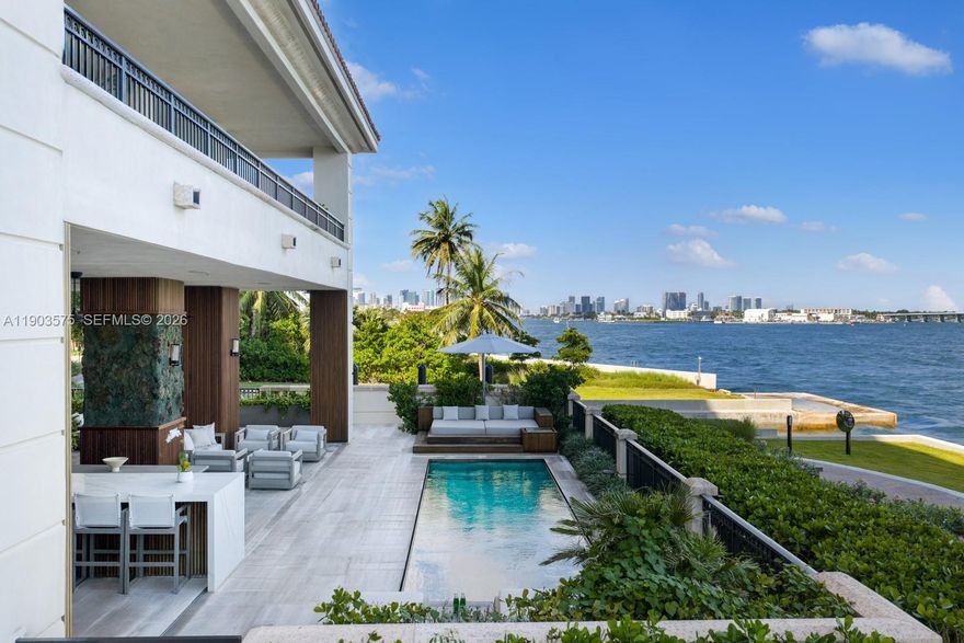 Rarely available, the Lanai at Luna redefines Fisher Island grandeur. Comprised of 4 suites, this corner estate offers a 4,782SF wraparound terrace with 32' Private Pool. Designed by Italian architect Augusto Busnelli, the foyer opens to a 12’ ceiling great room with stone and oak flooring, framed by sweeping bay and skyline views through picturesque glass doors. The Boffi kitchen features a dine-in island, Miele & Sub-Zero appliances, and a sunlit dining area. Custom-milled walls lead to the palatial primary suite with dual dressing rooms, a marble bath, office nook & vanity station. Ideal for entertaining, the expansive outdoors present a Summer kitchen, covered lounge, & daybed. The 216-acre private Fisher Island is home to a marina, tennis, golf, beach club and 7 restaurants. Palazzo Della Luna is the premier address on Fisher Island, featuring the only one-of-its-kind resident's lobby lounge serving breakfast and lunch.