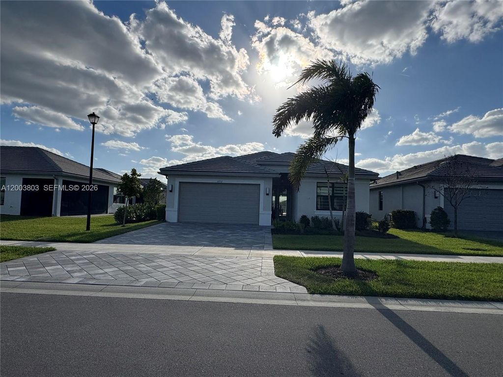 Photo of 12712 SW Blue Mangrove Pkwy, Port St Lucie, FL 34987 (MLS # A12003803)