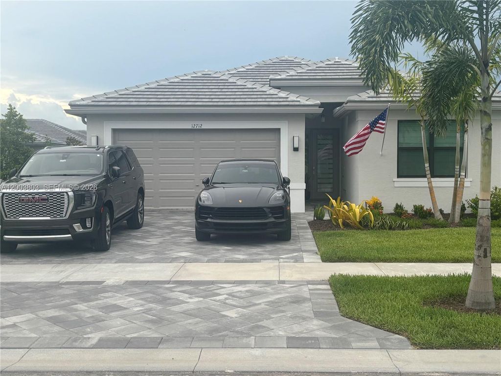 Photo of 12712 SW Blue Mangrove Pkwy, Port St Lucie, FL 34987 (MLS # A12003803)