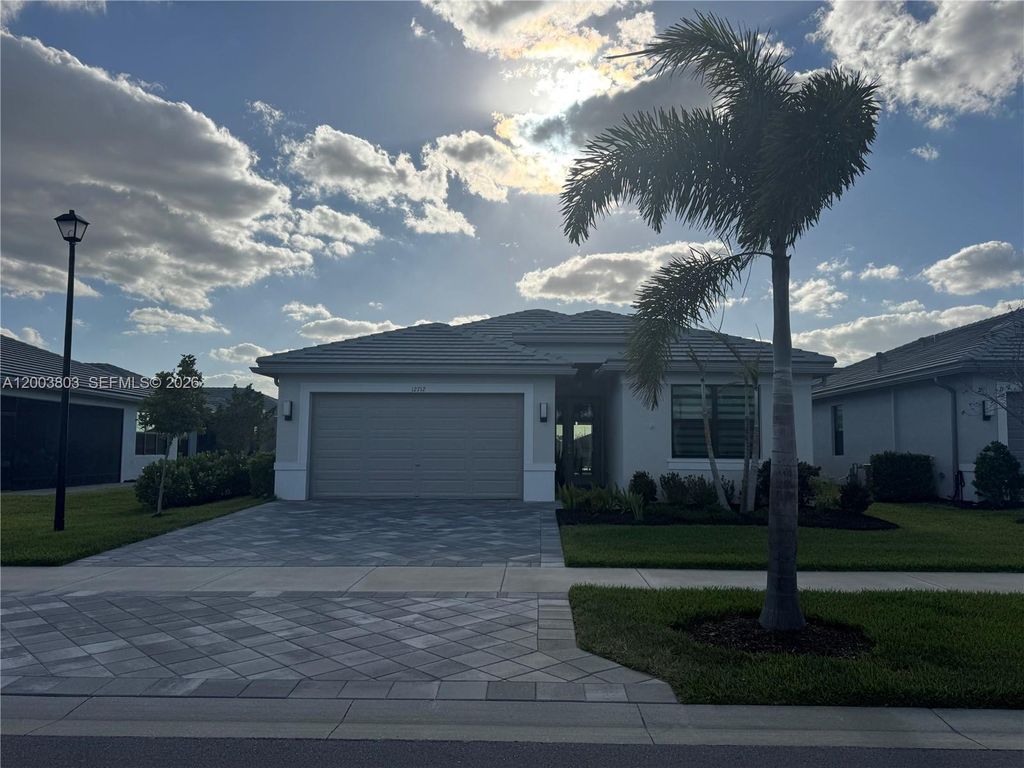 Photo of 12712 SW Blue Mangrove Pkwy, Port St Lucie, FL 34987 (MLS # A12003803)