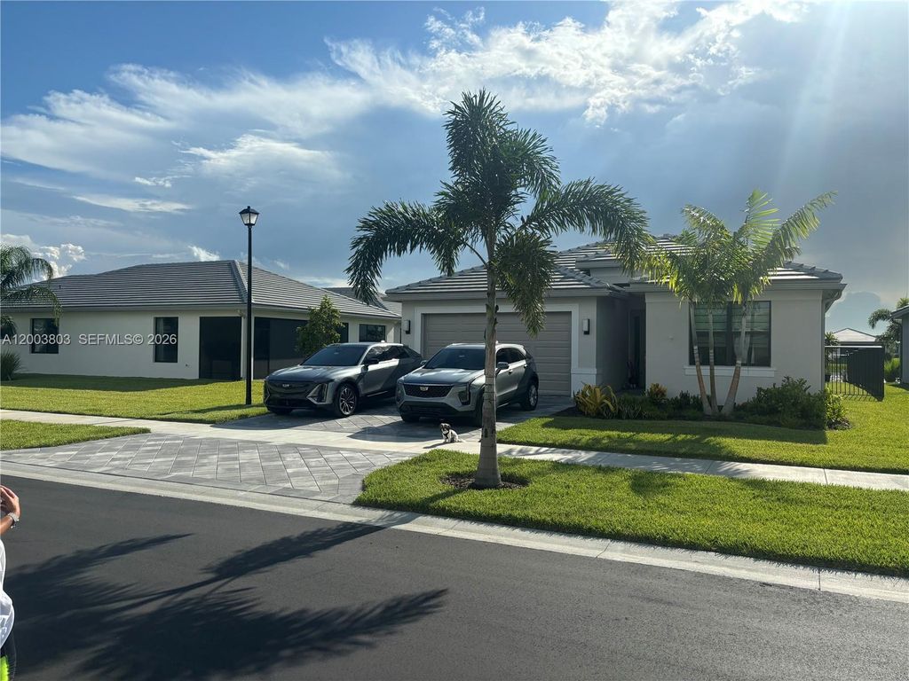 Photo of 12712 SW Blue Mangrove Pkwy, Port St Lucie, FL 34987 (MLS # A12003803)