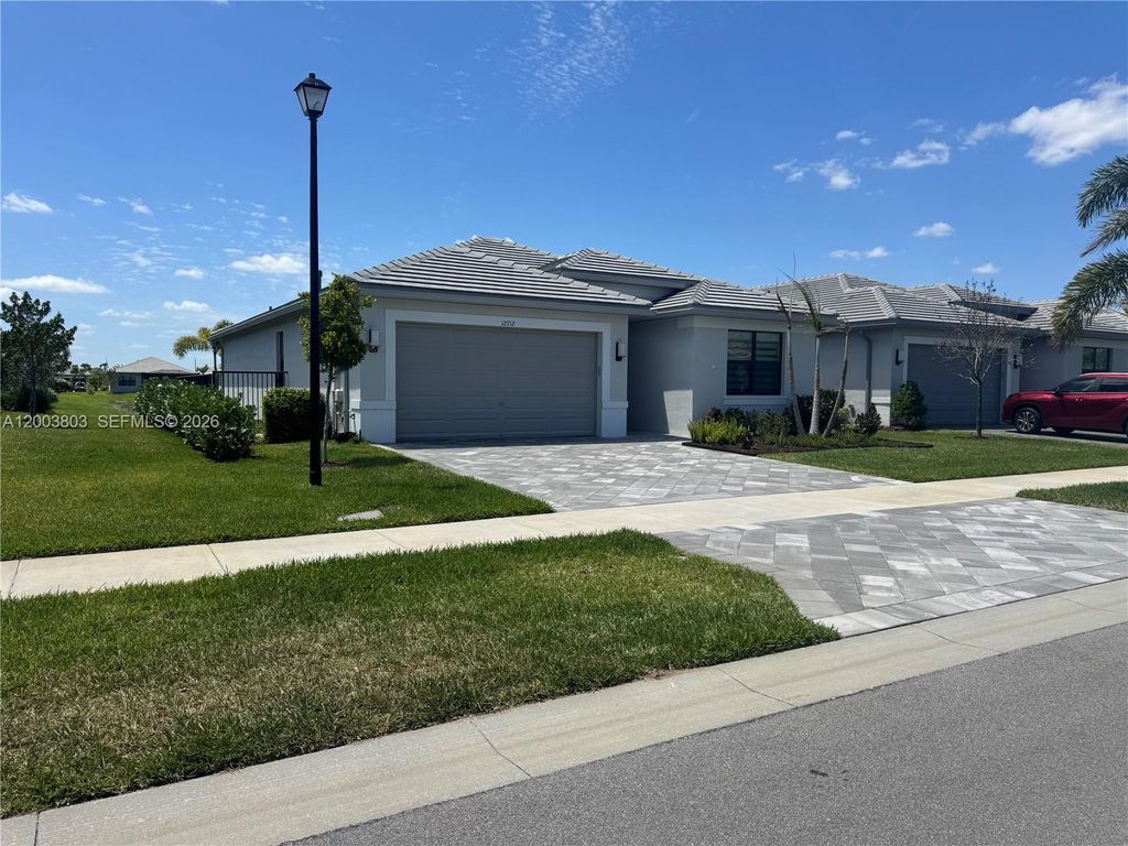 Photo of 12712 SW Blue Mangrove Pkwy, Port St Lucie, FL 34987 (MLS # A12003803)