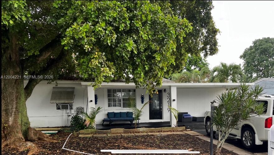 Fantastic remodeled 3/2 with open floor plan and natural light that shows like a model home. White wood floors lead you to the kitchen counter bar top with new cabinets and recessed lights throughout. This home boasts 2 family rooms for separate viewing areas. The back family room has extra-large glass patio doors that look out to lit palm trees in this hardscaped concrete fenced in backyard with room for a pool if you desire. Enjoy a cookout on the custom built in brick grill. Complete with 3 sets of hotel grade steel patio furniture. Lighted palm trees make this a plush outdoor entertainment courtyard. ALL PATIO FURNITURE IS INCLUDED IN SALE PRICE ($20K VALUE) Add your finishing touches to this UNDER PRICED home. Great for first time owner or investor. Approval letter required.
