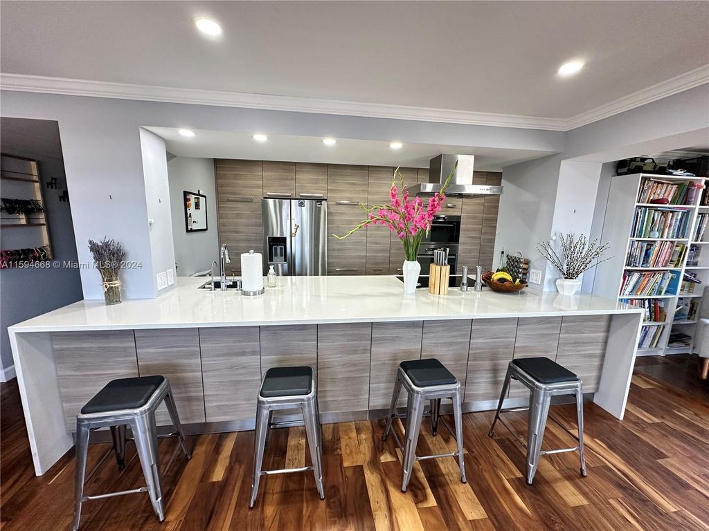 Photo of 401 Golden Isles Dr #1013, Hallandale Beach, FL 33009 (MLS # A11594668)