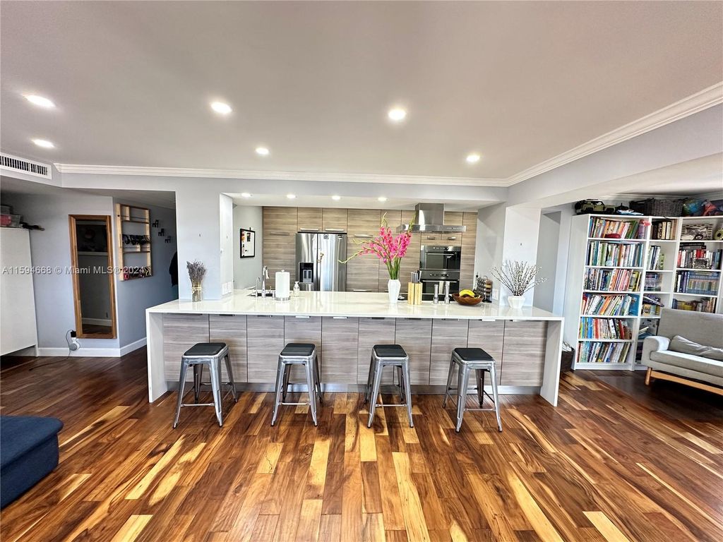 Photo of 401 Golden Isles Dr #1013, Hallandale Beach, FL 33009 (MLS # A11594668)