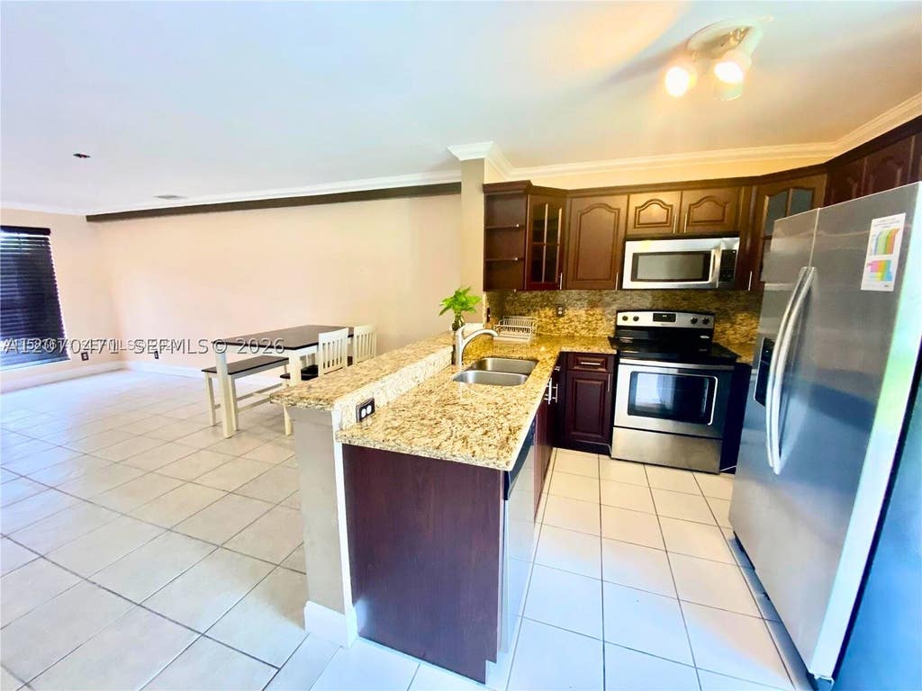 Photo of 2864 Cambridge Ln, Cooper City, FL 33026 (MLS # A12070471)