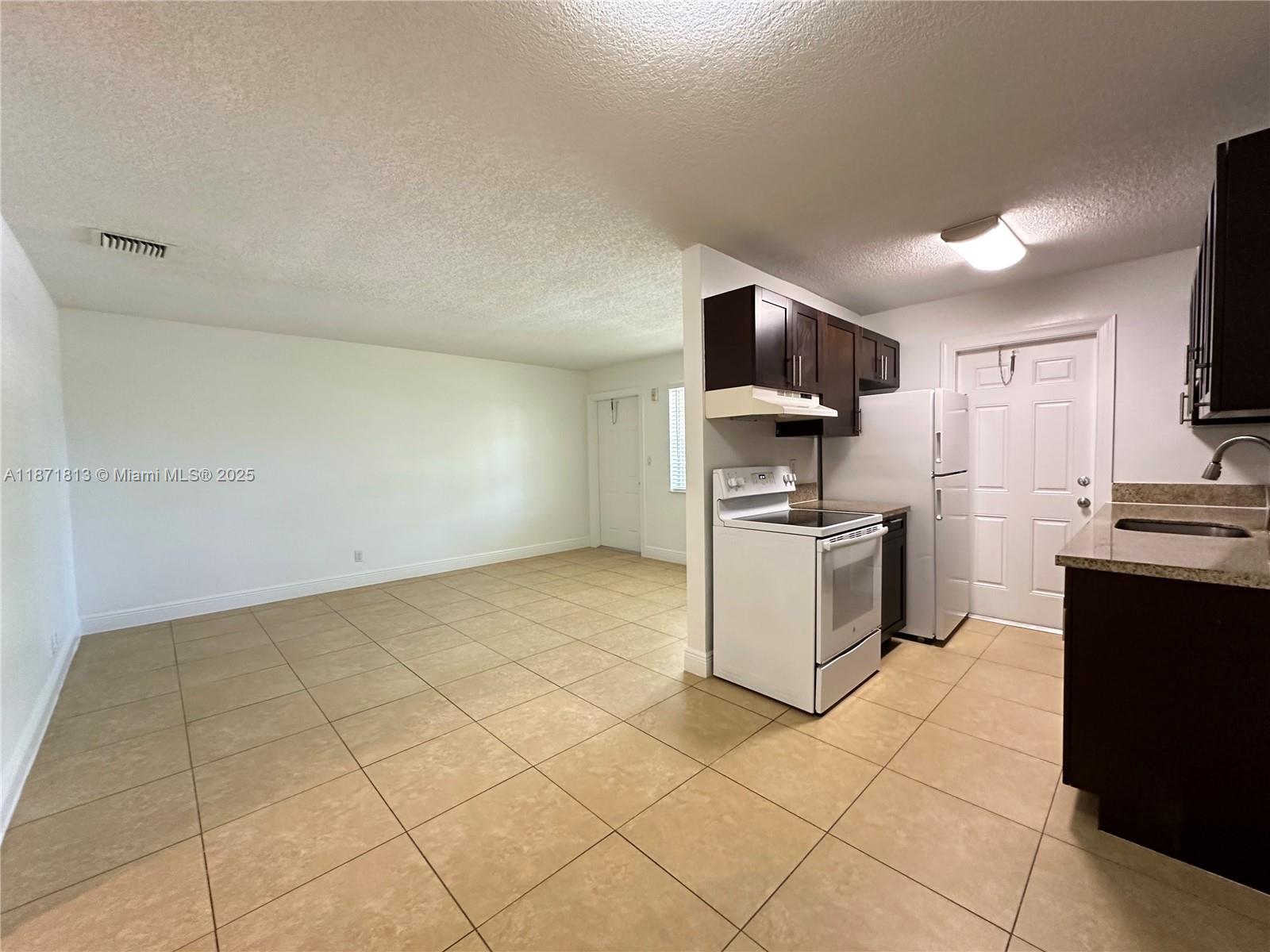 SPACIOUS and newly upgraded 1 bed/1bath in Pompano Beach!!! Charming 2nd floor unit in a beautiful complex. Features newer tile floors, granite countertops, wooden cabinets, impact windows, central AC. Large living and dining room area with full kitchen and upgraded appliances. Located in a gorgeous, well-maintained community with plenty of amenities such as a sun deck, garden area, BBQ / picnic area, private pool, and full laundry room on-site. Gated community with security patrol. Water, waste, sewer, maintenance, pest control + 1 assigned tandem parking space included in rent. Pets welcome with 1x pet fee. Property is in a great area - centrally located, tucked away on a quiet street in a pretty neighborhood yet close to all of the major highways, shops, restaurants, schools, and parks.
